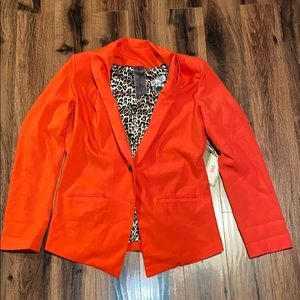 Red blazer with leopard print lining